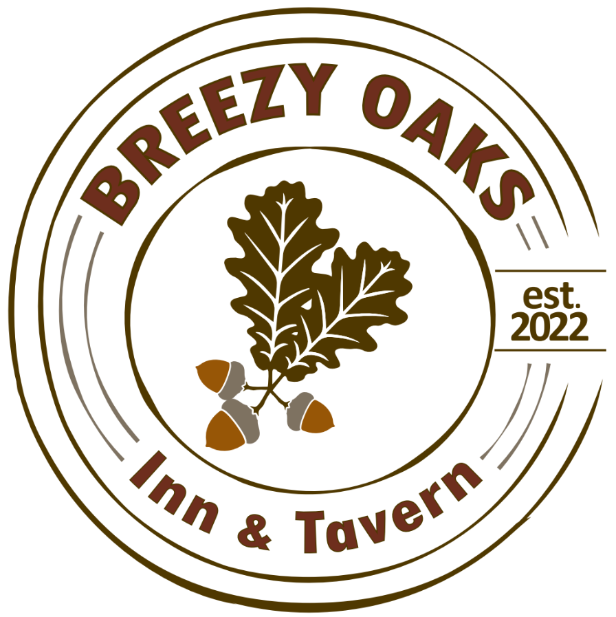 Photo shows Breezy Oaks Inn & Tavern logo. The log has acorns attached to leaves in the center of the logo with the words "Breezy Oaks" at the top and "Inn & Tavern" at the bottom. There are several circles surrounding the them.
